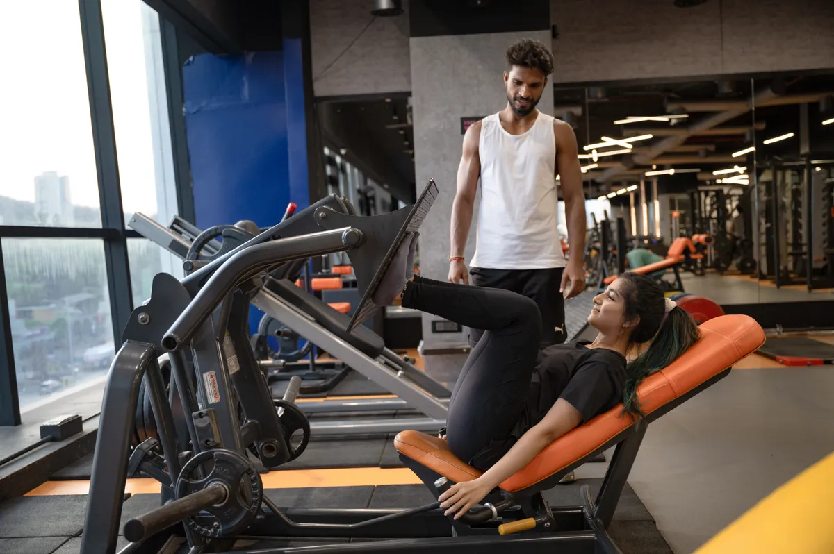 Trainer guiding a member at Fit Playce